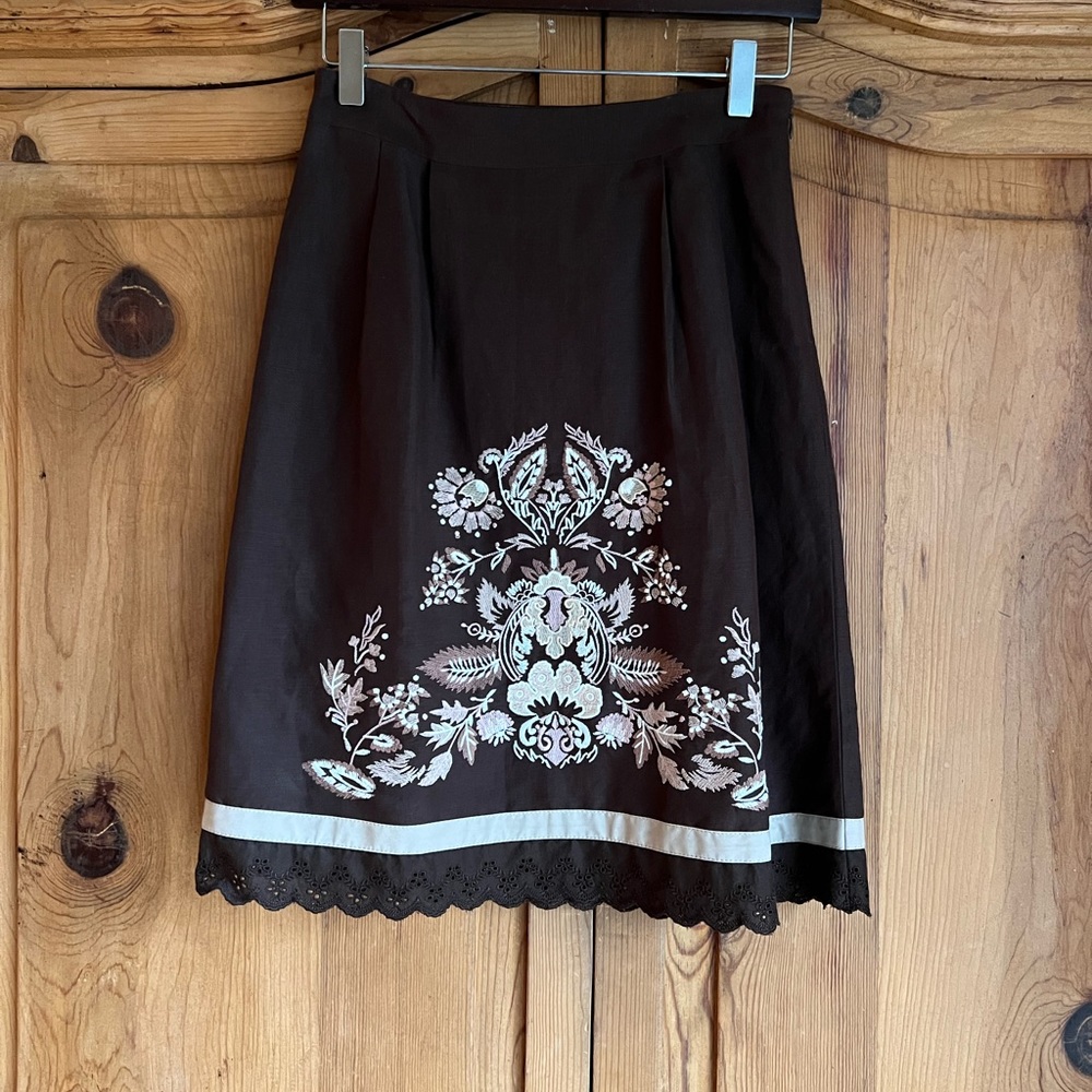 Ann Taylor Loft brown skirt with cross stitch pattern.